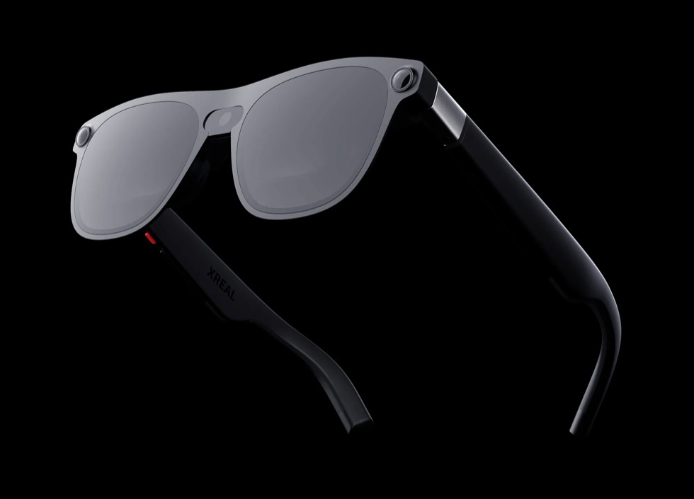 XREAL Aura glasses with a silver frame and front-facing sensors