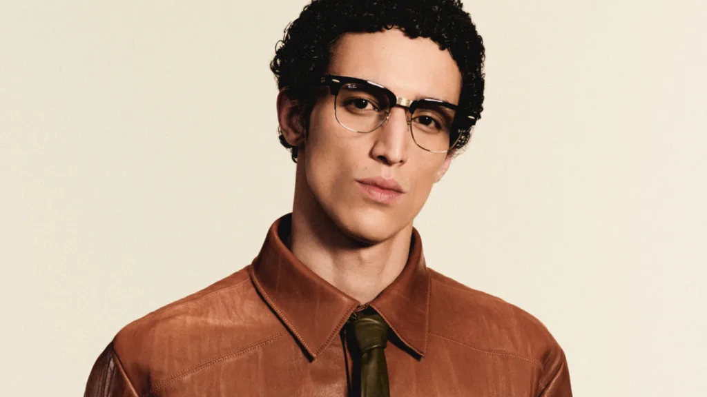 Model wearing Ray-Ban Meta Audio glasses in a Clubmaster frame